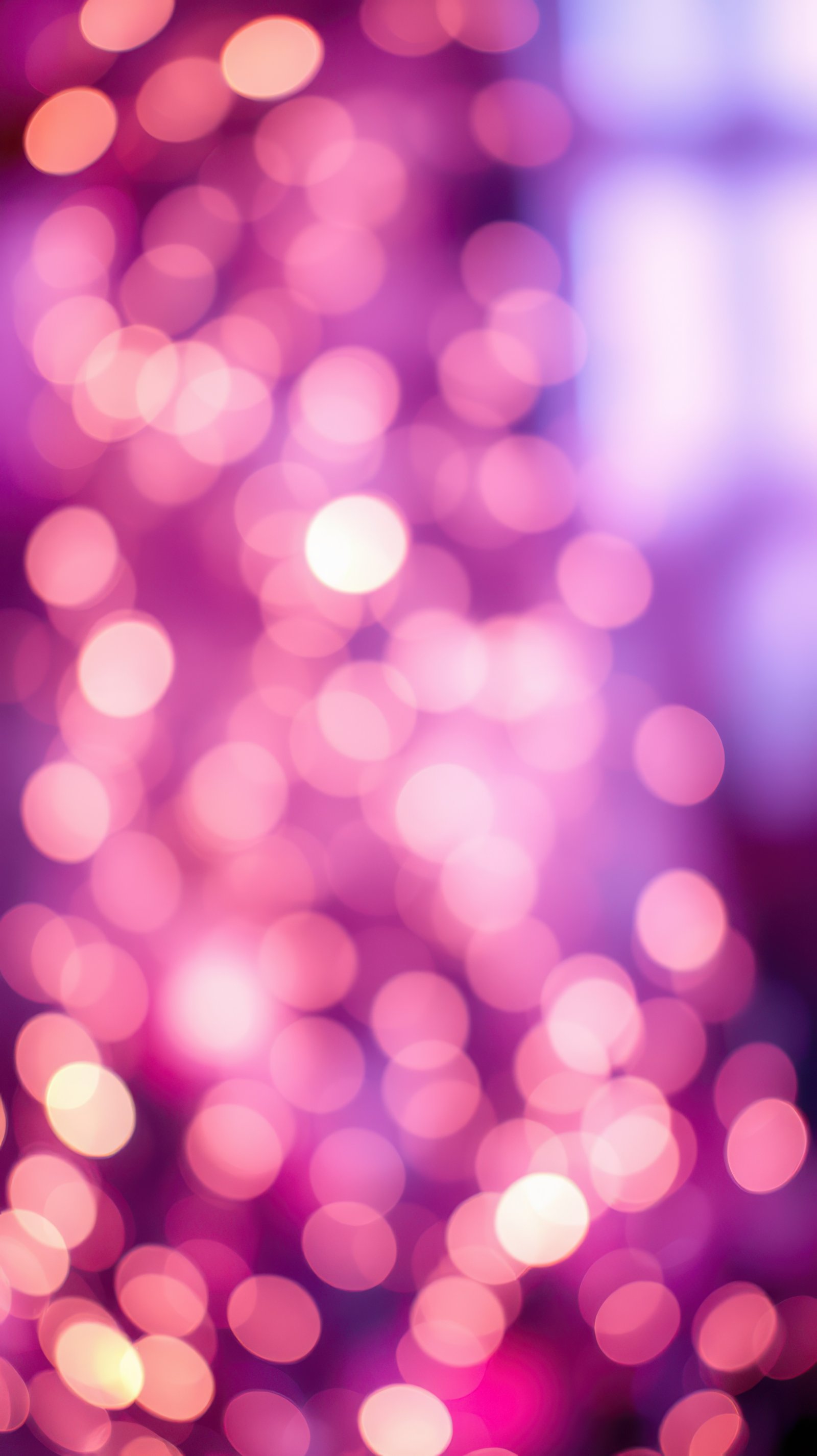 Soft glowing bokeh lights create a dreamy atmosphere for festive celebrations during the evening